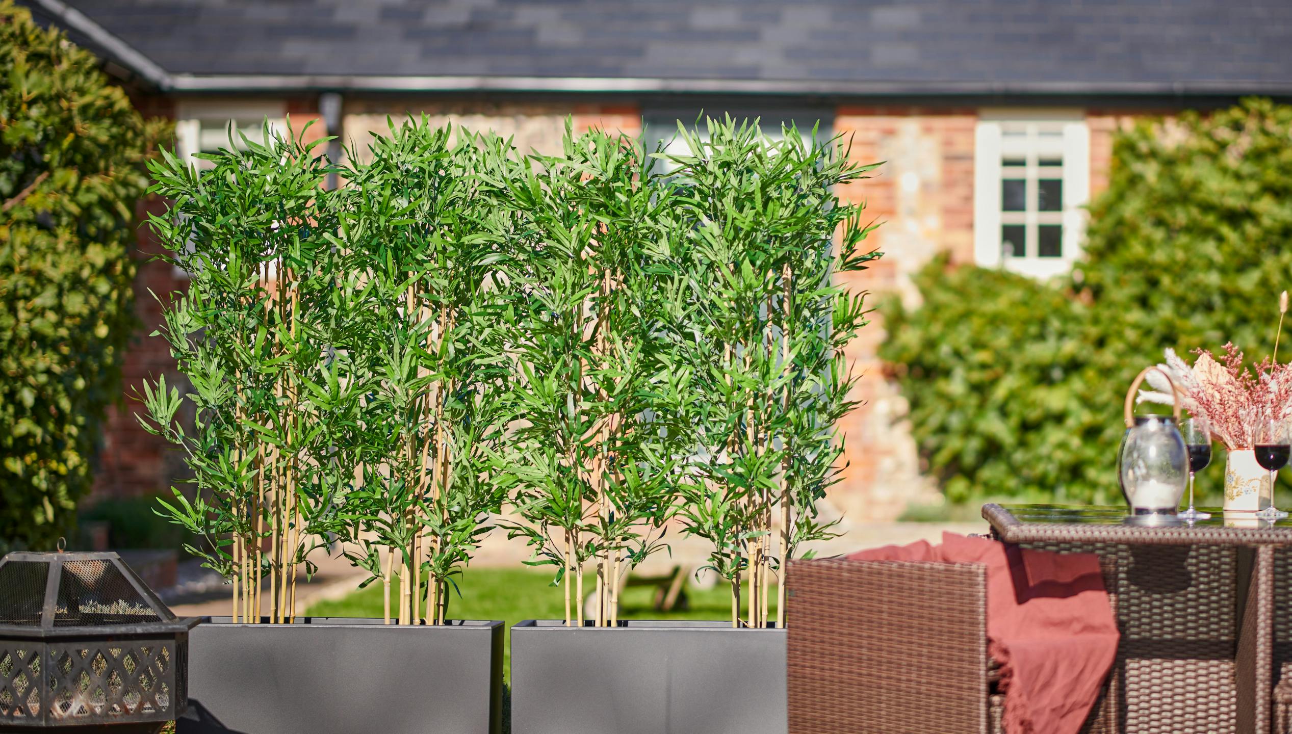 Artificial bamboo in planters screening