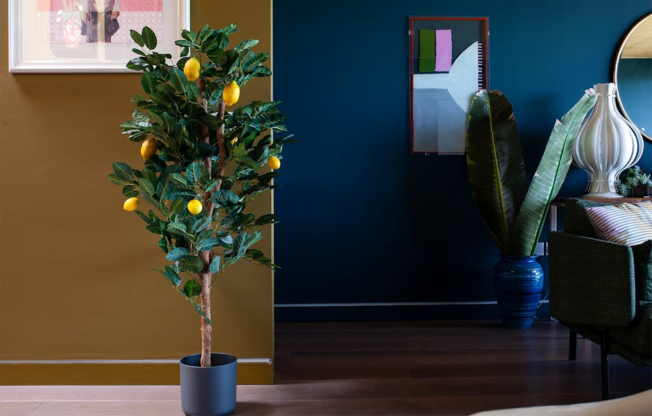 Artificial lemon tree by Blooming Artificial in dark interior