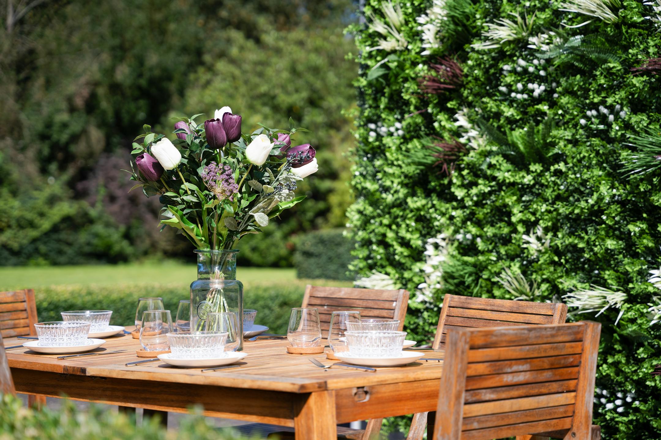 Artificial twilight bouquet on wooden table outdoors