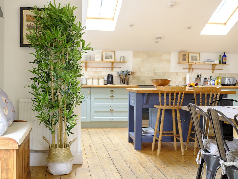 Artificial oriental bamboo tree standing in colourful kitchen