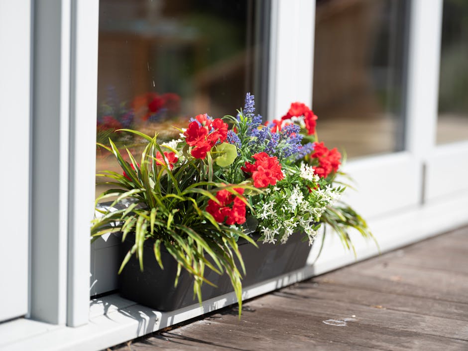 Mixed flower window box on a porch
