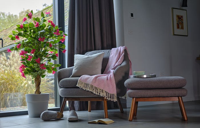 Faux bougainvillea tree with armchair