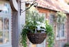 Outdoor artificial hanging basket with calla lily flowers