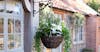 Outdoor artificial hanging basket with calla lily flowers