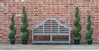 Outdoor artificial trees preview - boxwood spirals by garden bench