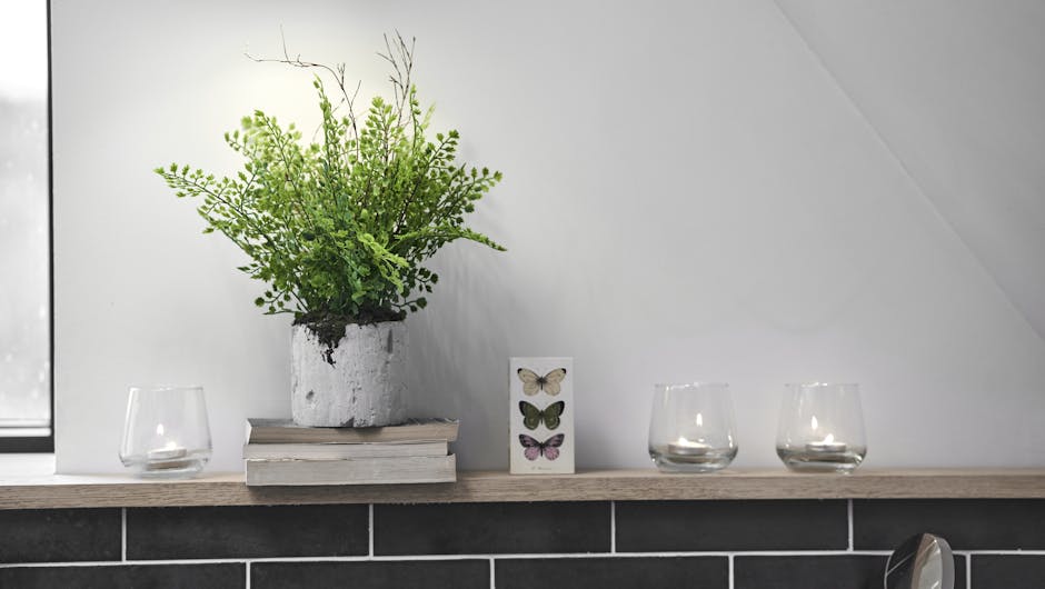 Beautiful faux maidenhair fern in relaxing candlelit bathroom