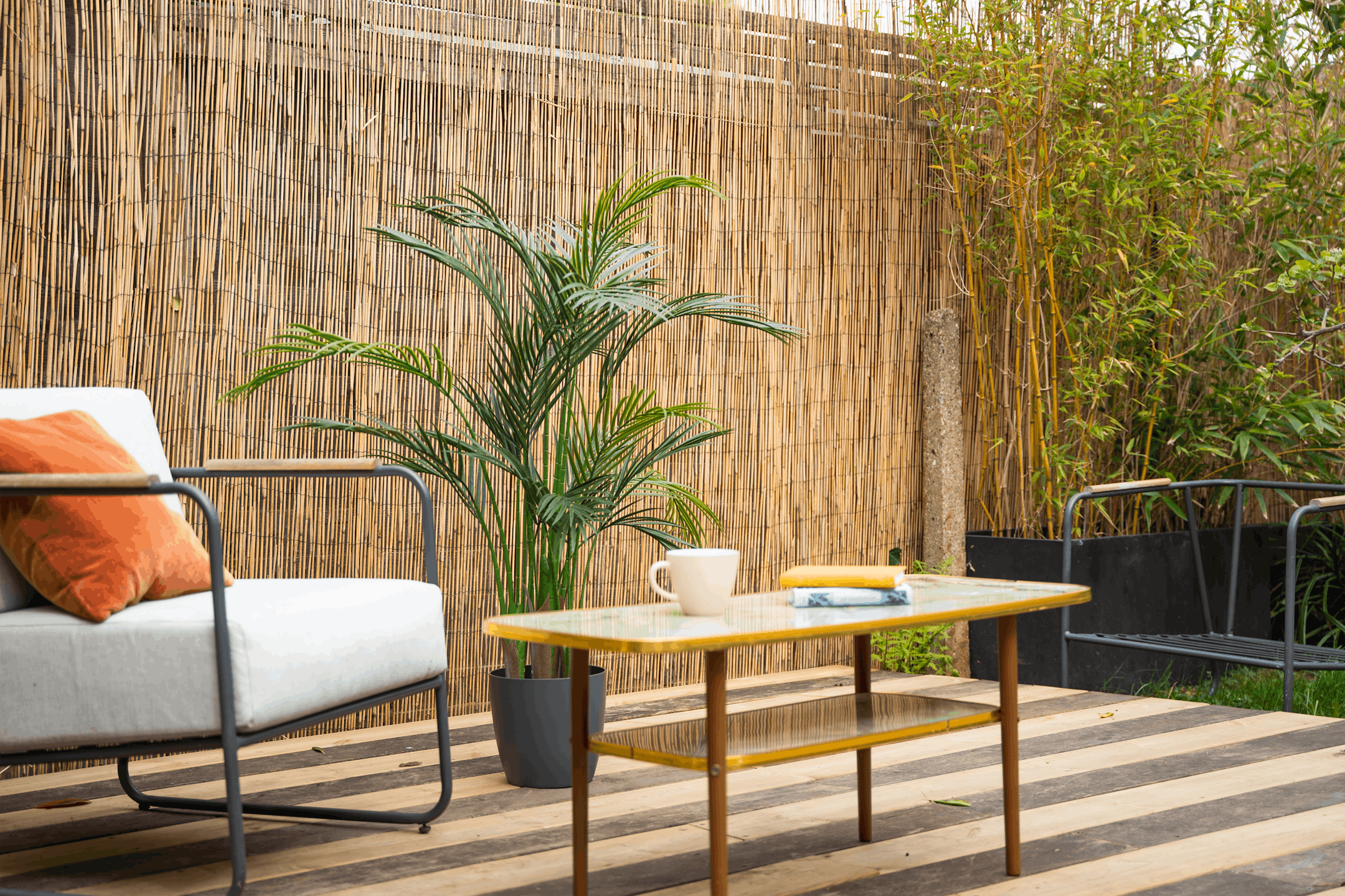 Artificial 140cm areca palm on garden decking