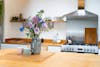 Artificial tranquil bunch on wooden kitchen island