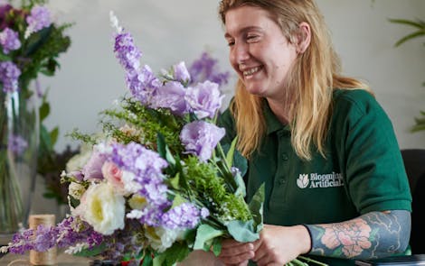 Arranging artificial amethyst bouquet