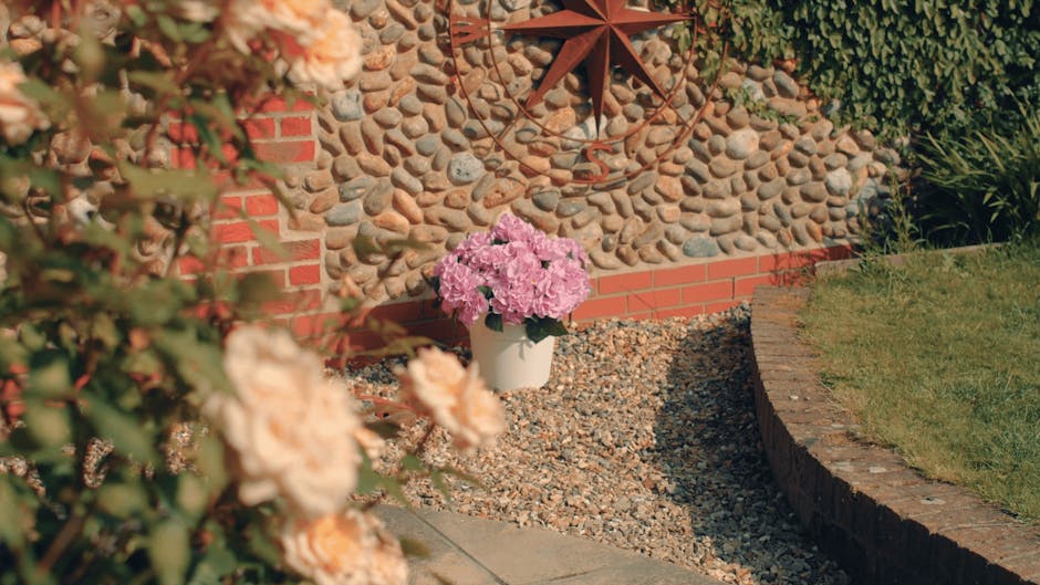 Pink faux hydrangea patio tub in garden