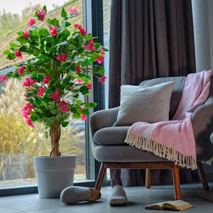 How to arrange artificial plants banner image showing fake bougainvillea in lounge