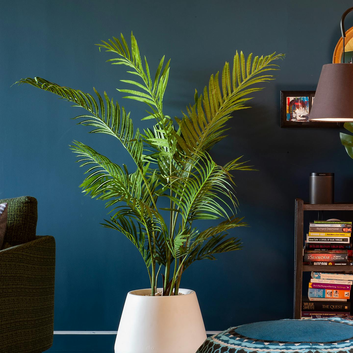 Artificial paradise palm tree in deep blue living space