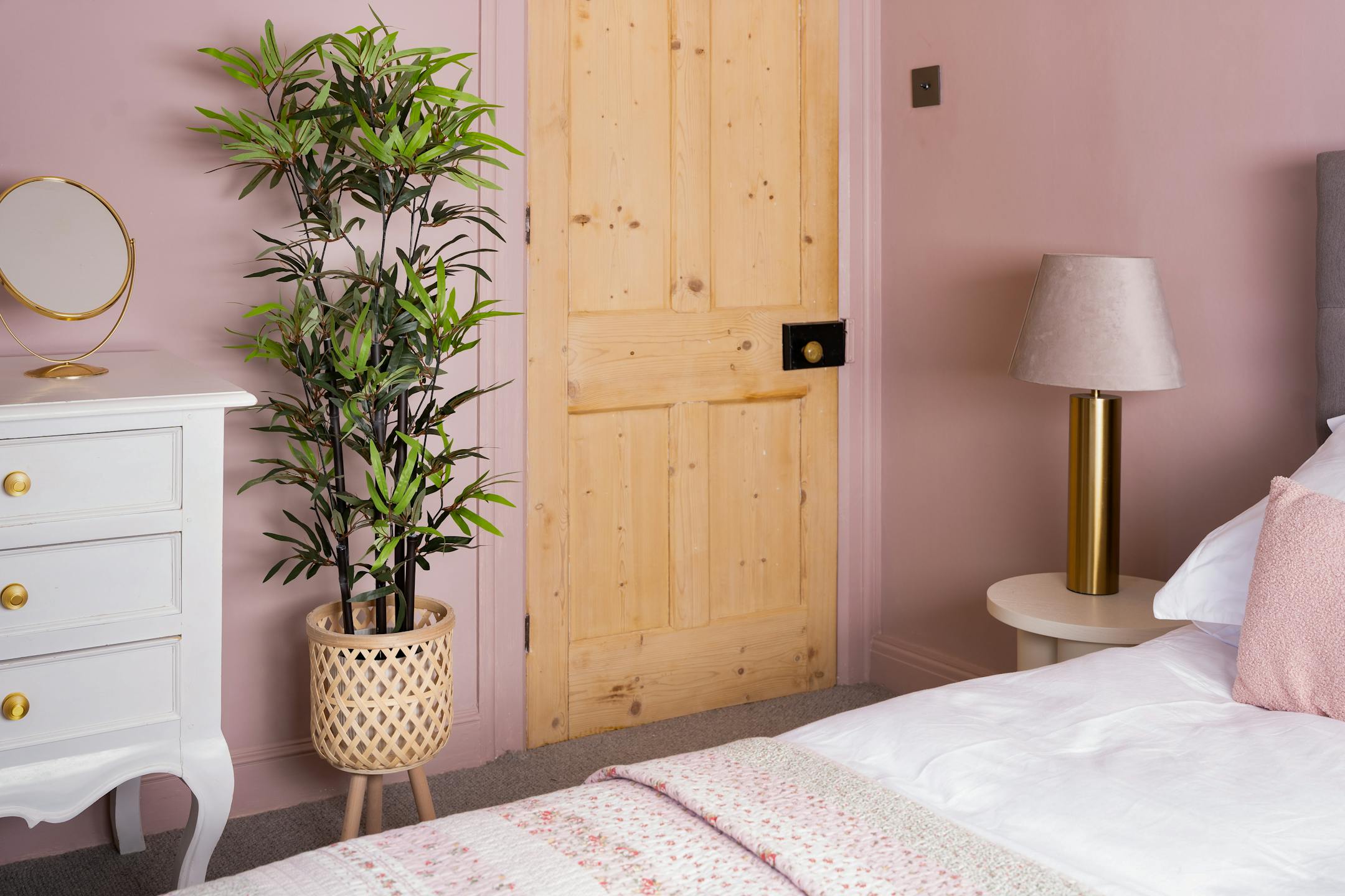 Artificial small black stem bamboo tree in pink bedroom