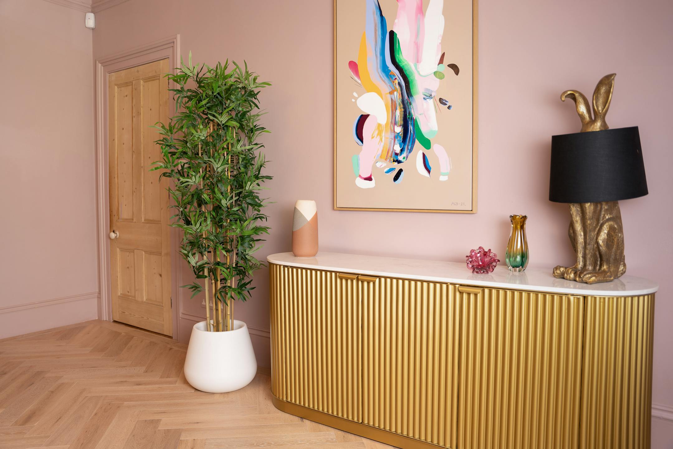 Artificial oriental bamboo tree in pink interior