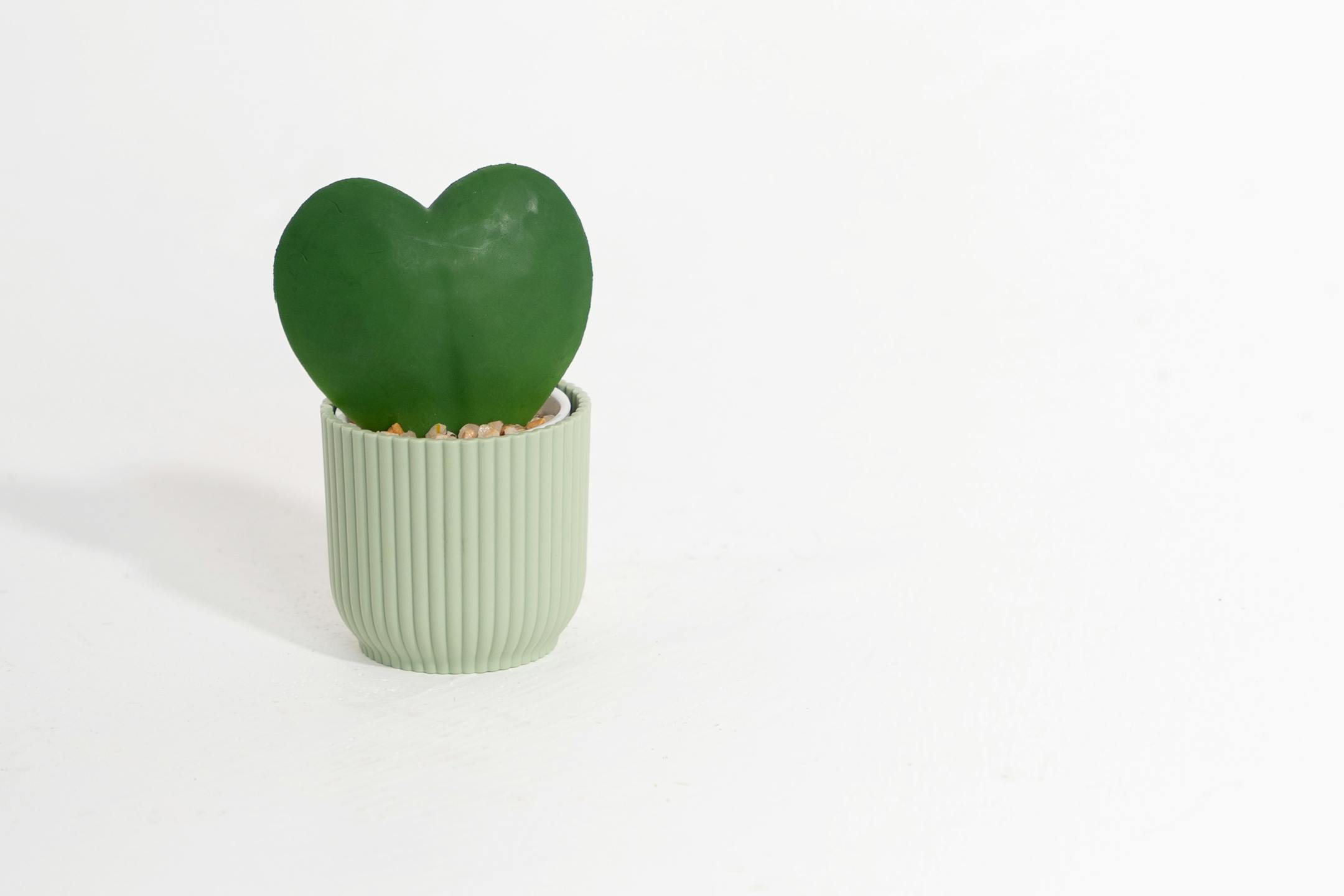 Artificial green hoya heart in green vibes pot
