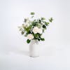 Faux enchanting bunch in white ceramic vase