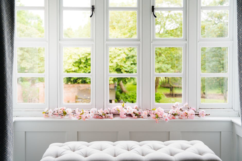 Artificial pink cherry blossom garland on window sill