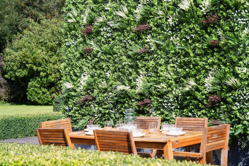 Artificial galaxy living wall with tablescape