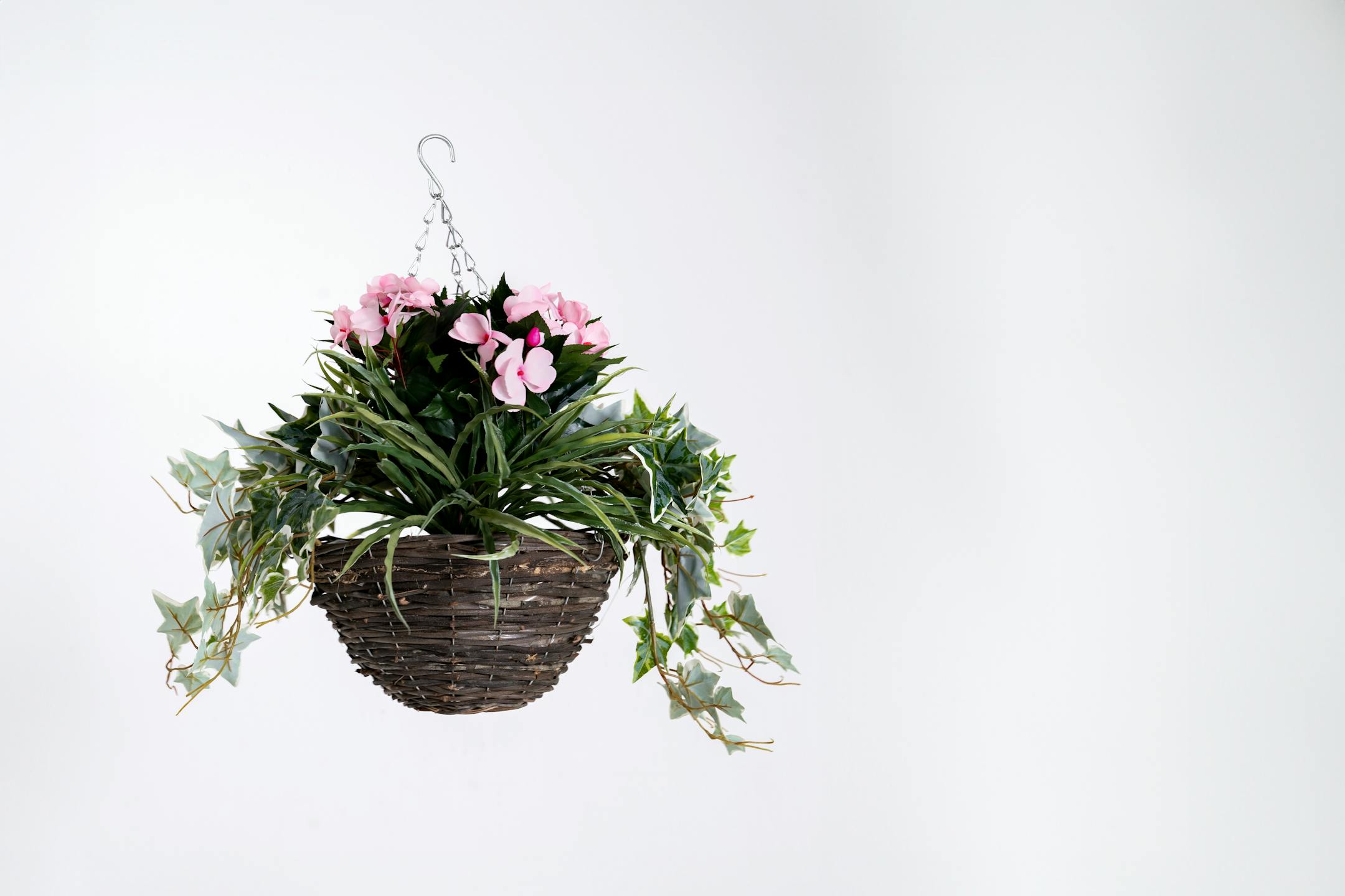 Artificial light pink busy lizzie  hanging basket
