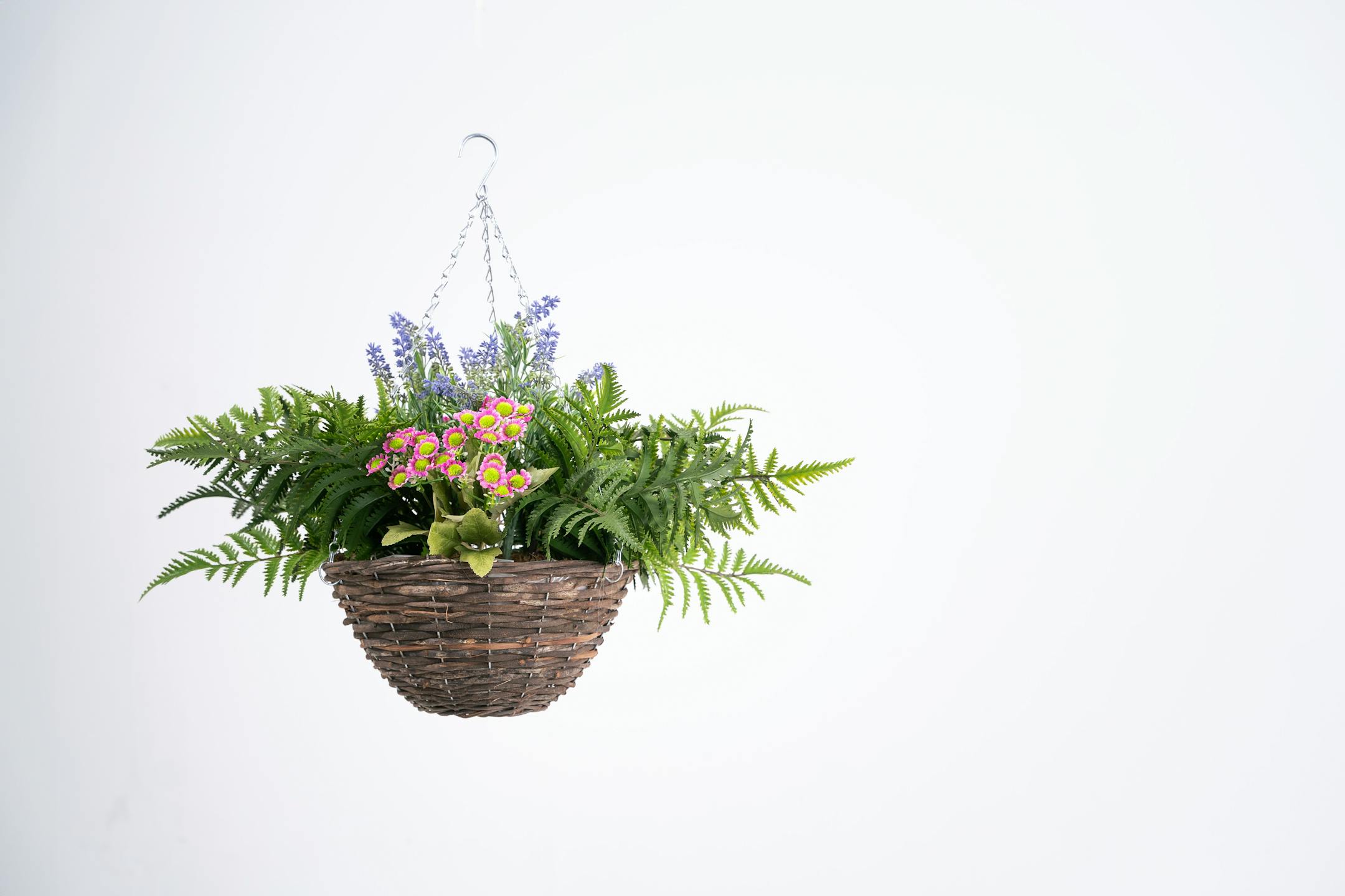 Artificial pink and purple wild flower hanging basket