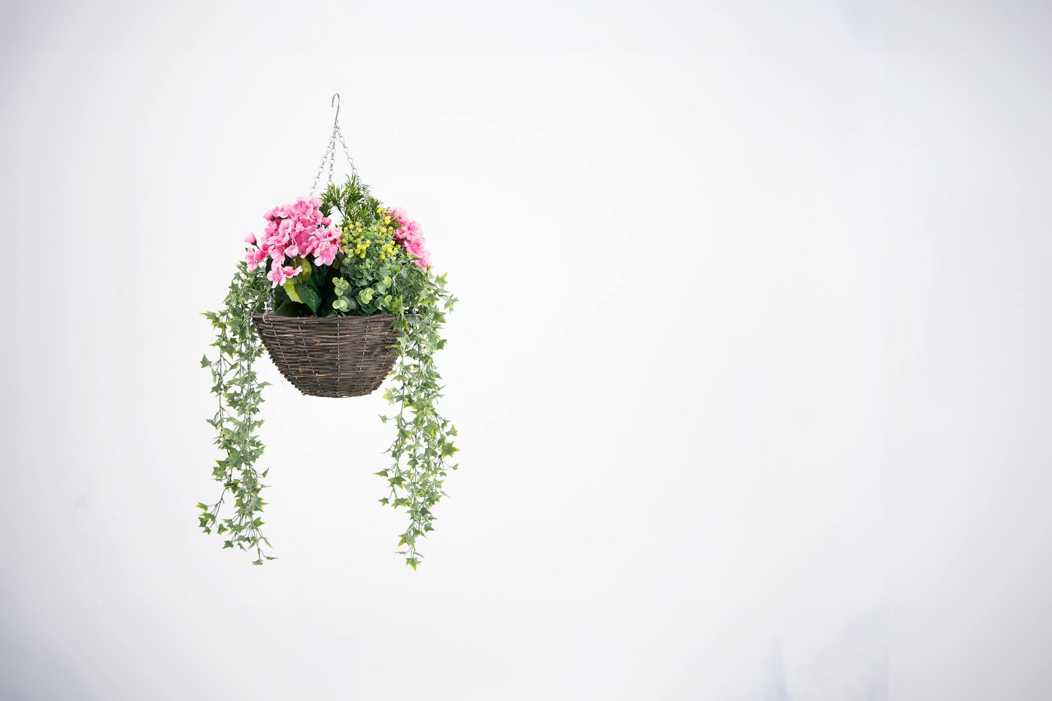 Artificial pink wild berry and geranium hanging basket