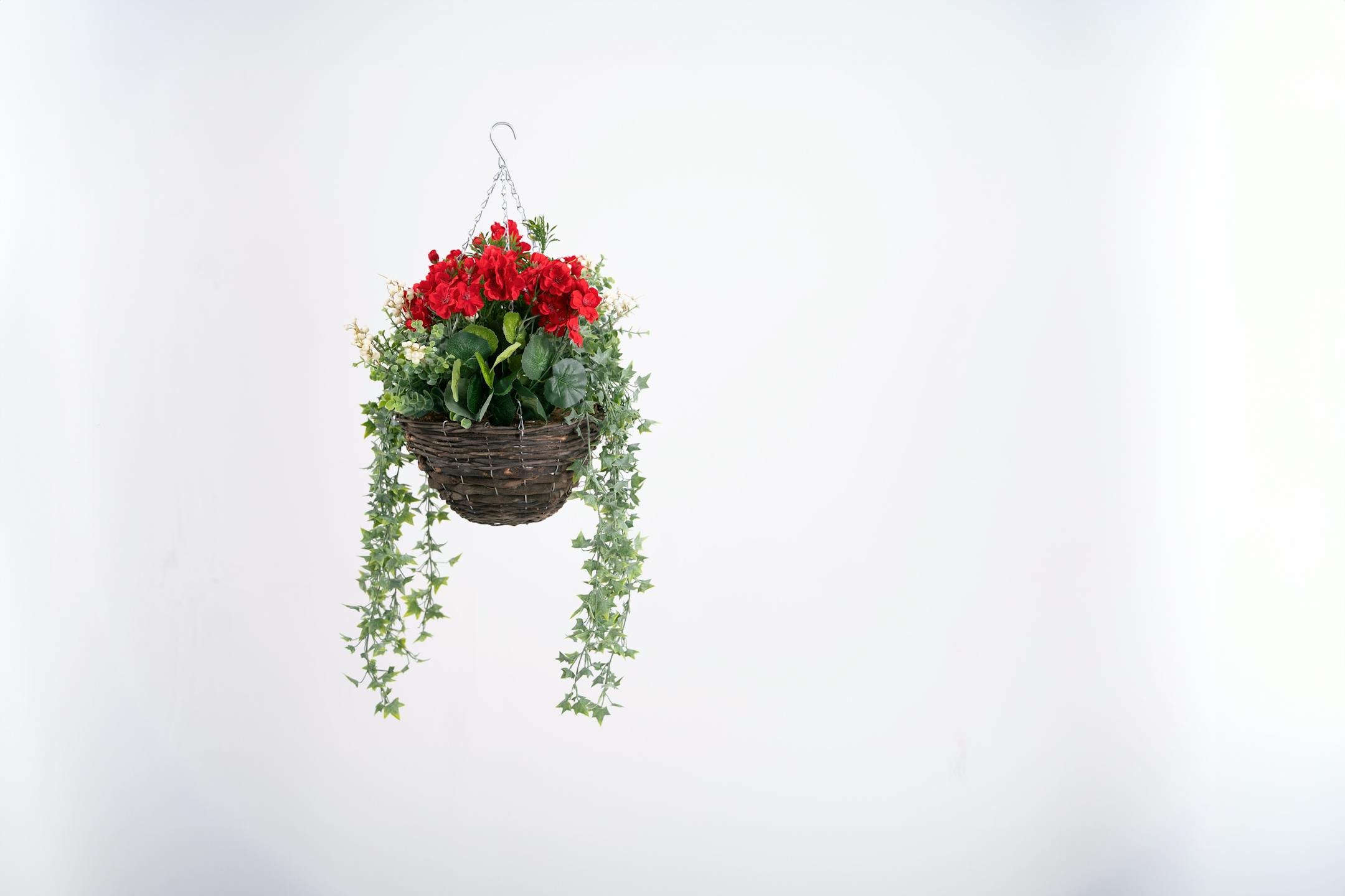 Artificial red wild berry and geranium hanging basket