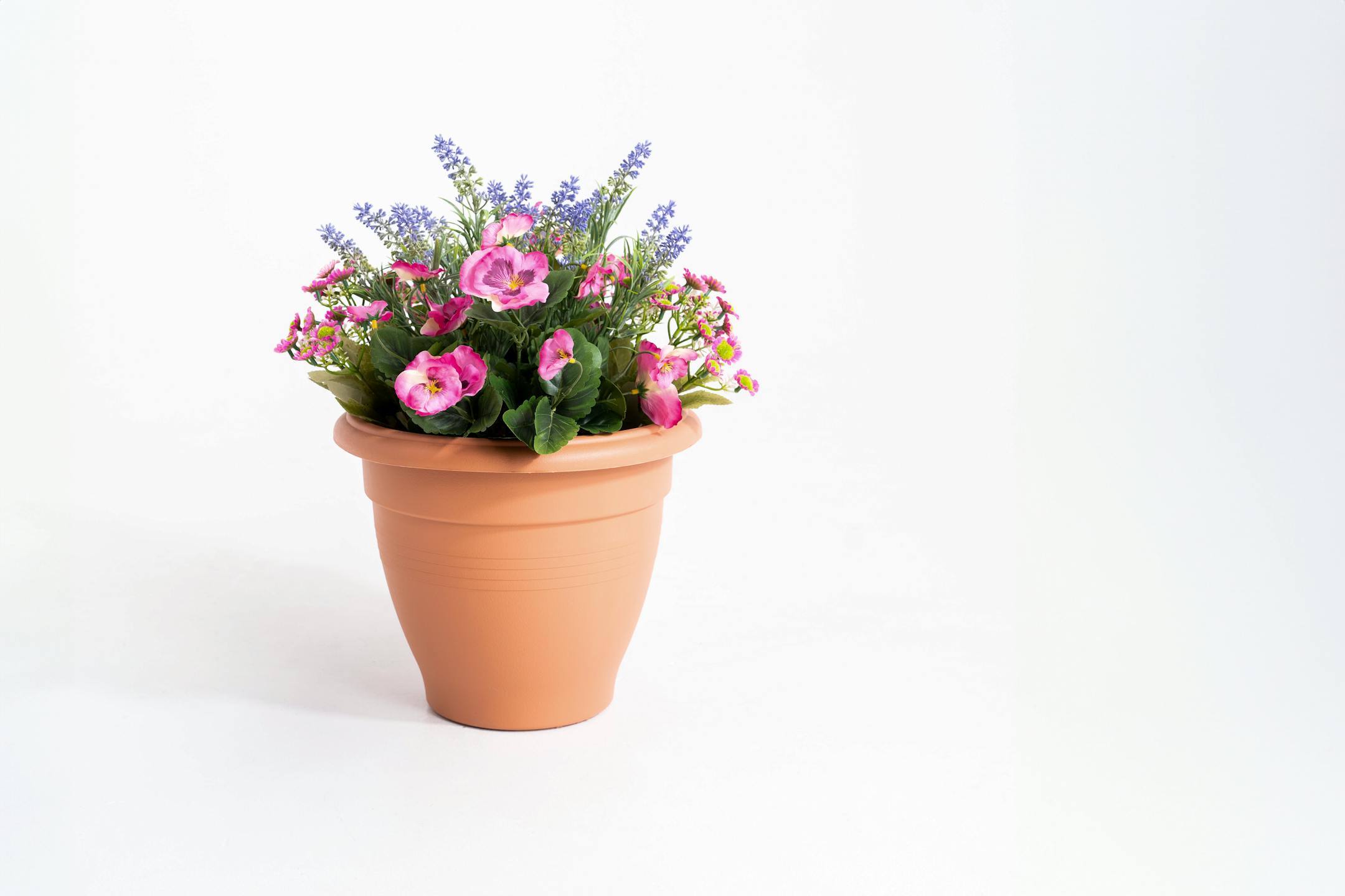Artificial pink pansy and lavender patio tub