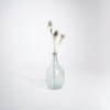 Artificial thistle stem in glass vase