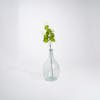 White artificial viburnum stem in glass vase