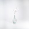 Artificial pussy willow stem in glass vase