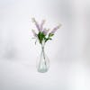 Three artificial stock sprays in glass vase