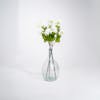 Three white artificial viburnum stems in glass vase