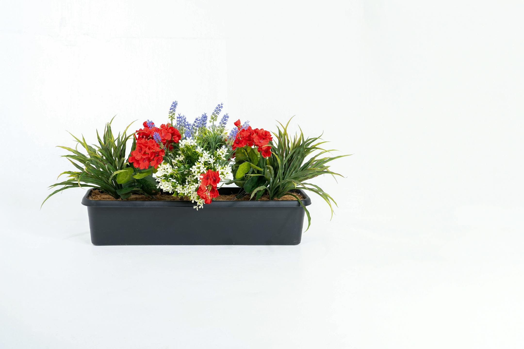 Artificial red and purple mixed flower window box