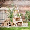 120cm 4ft outdoor artificial palm tree by hot tub in back garden