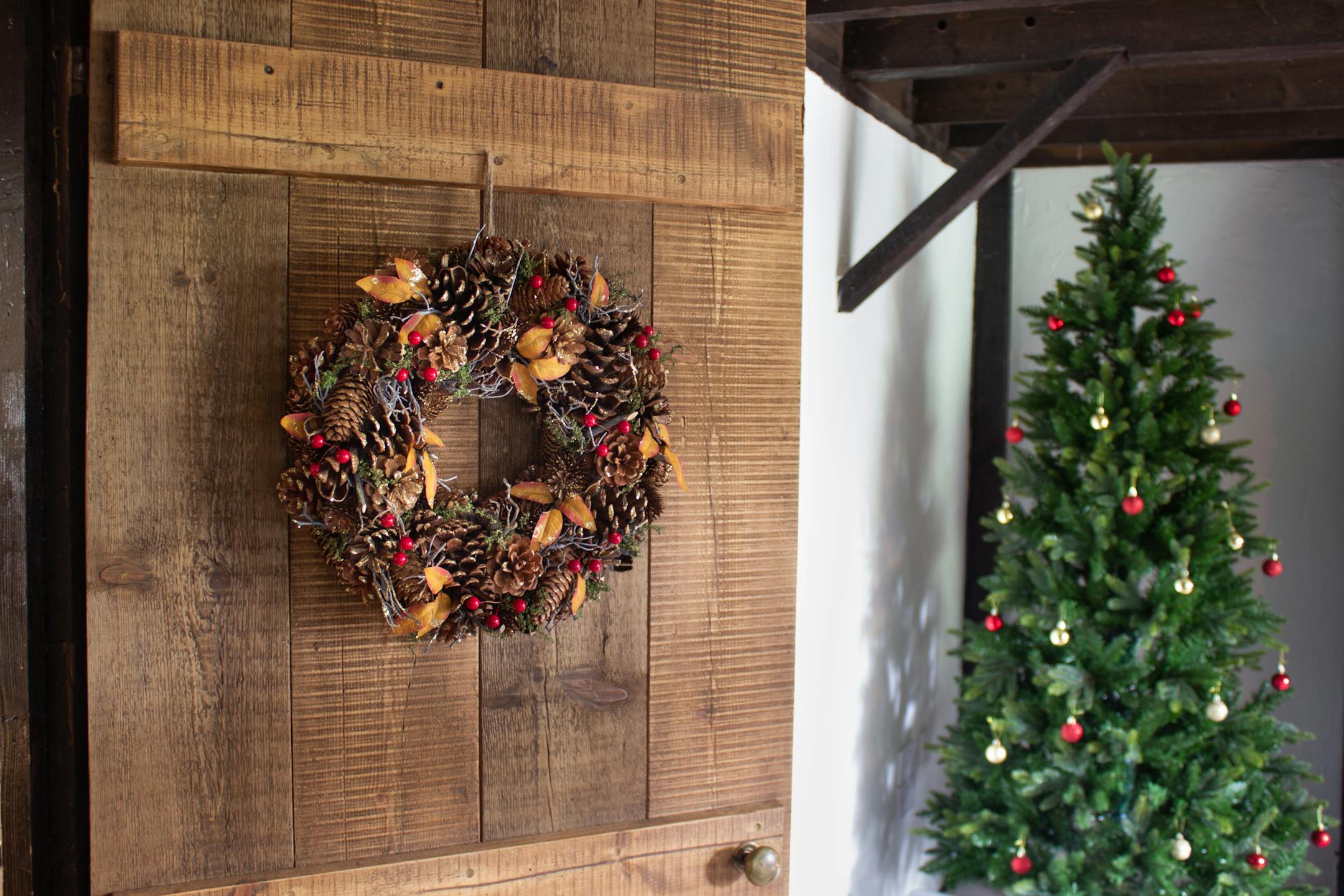 Faux 38cm winter spice wreath on wooden door