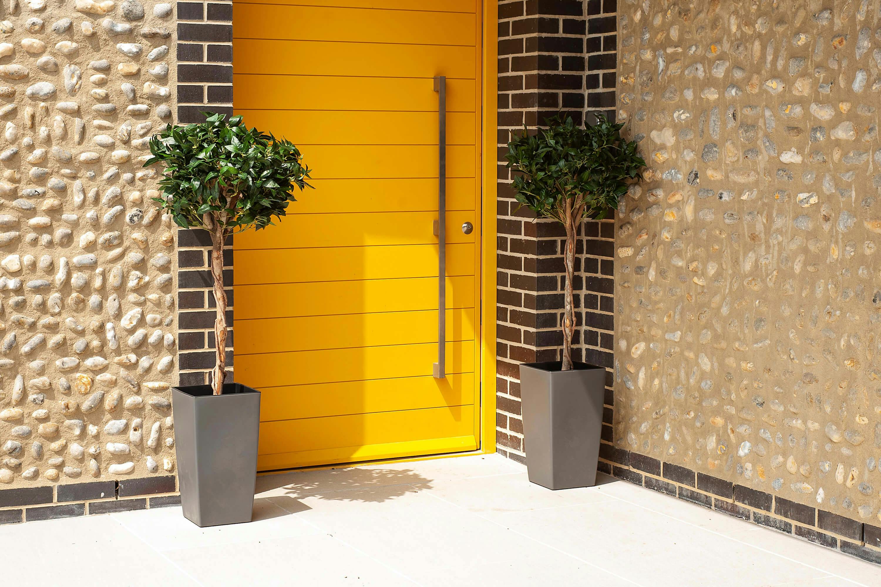 4ft faux bay trees by yellow front door