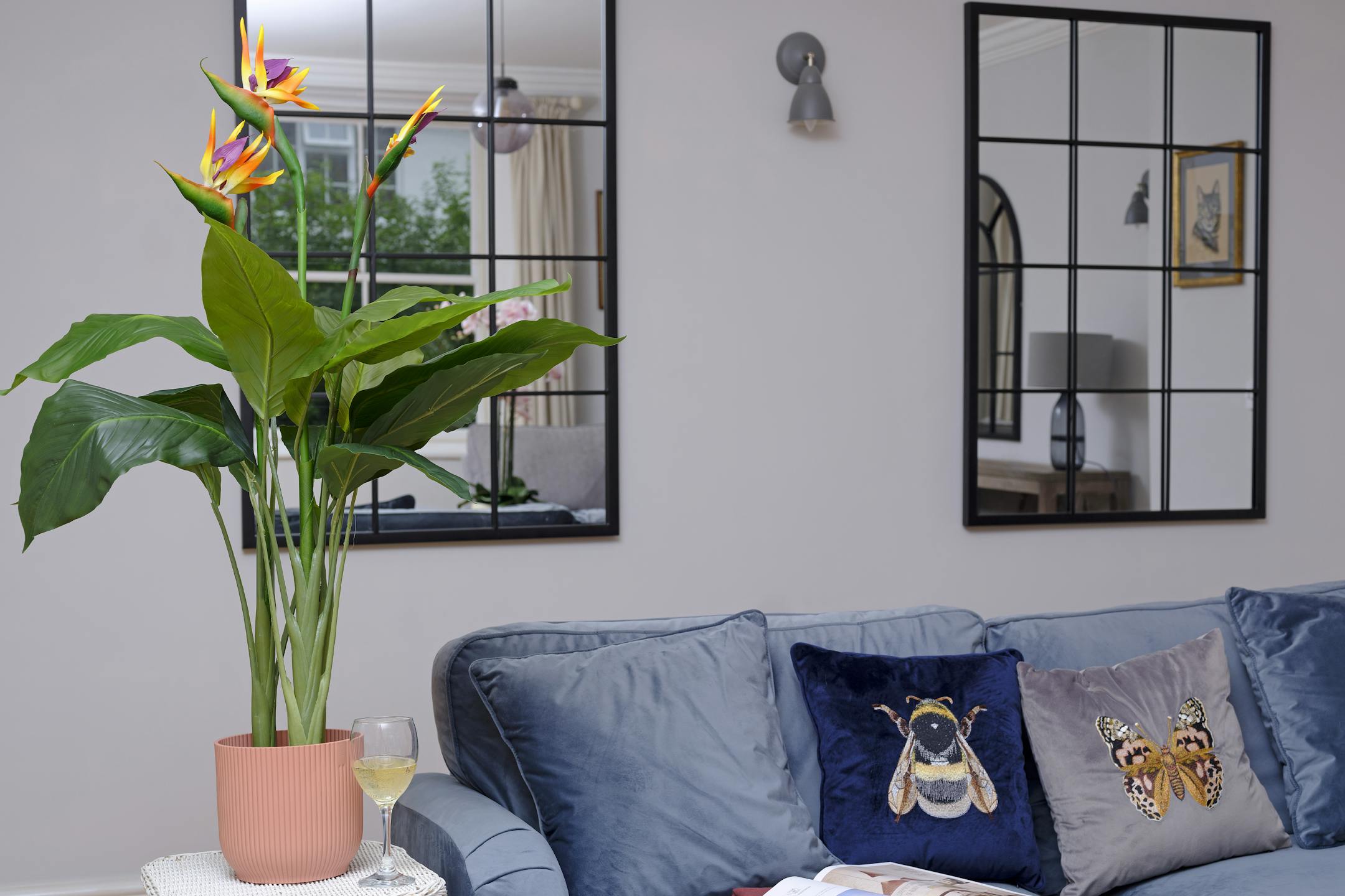 Artificial bird of paradise in blue living room