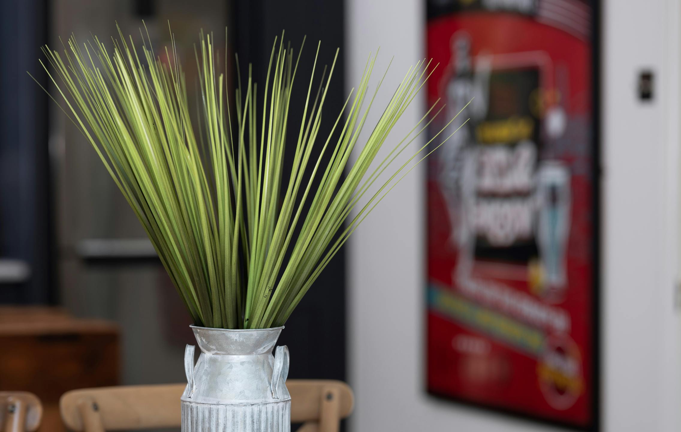 Faux china grass in metal container