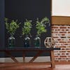 Three faux clematis spray vases on blue bench