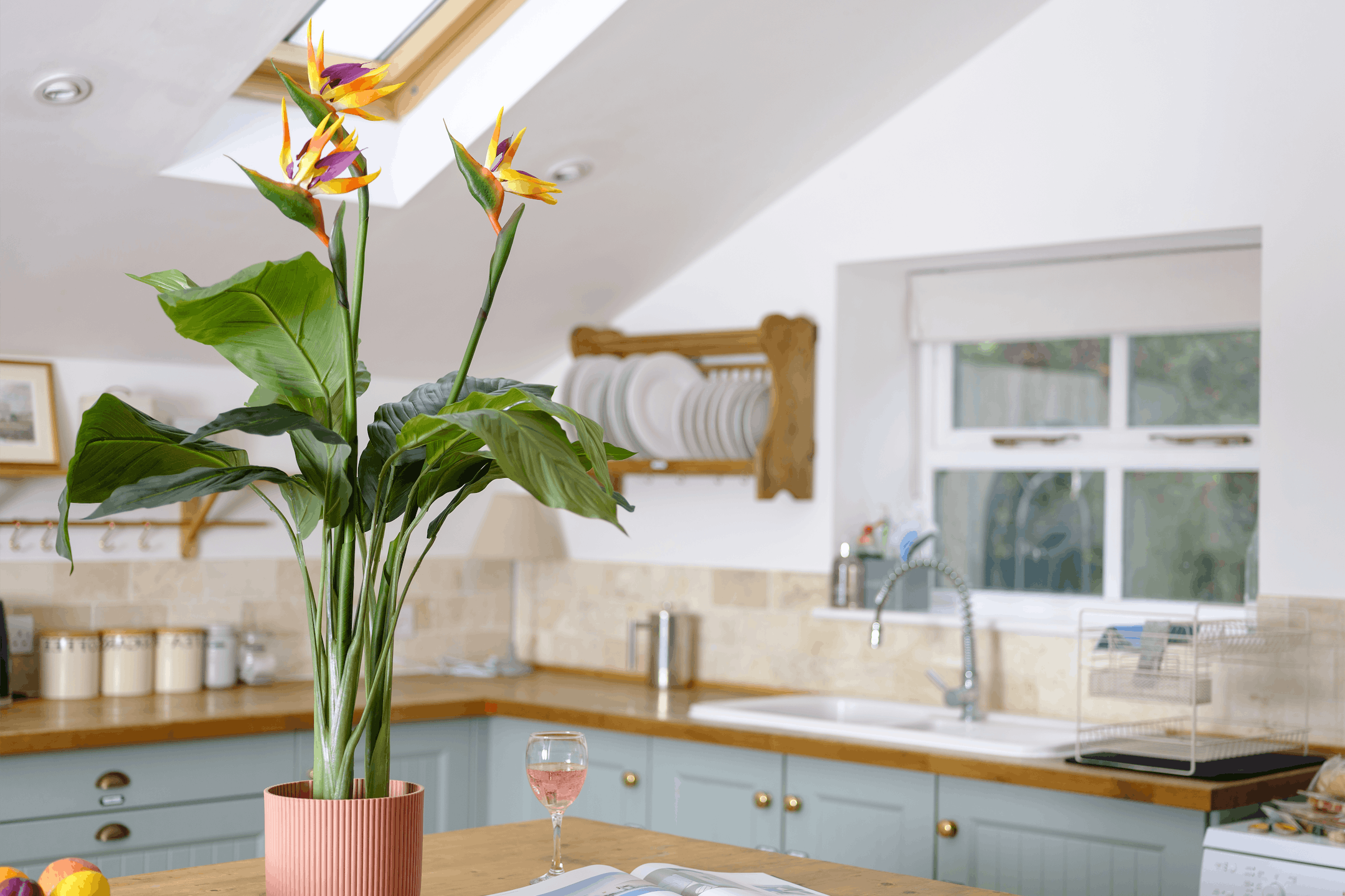 Artificial bird of paradise plant on kitchen island