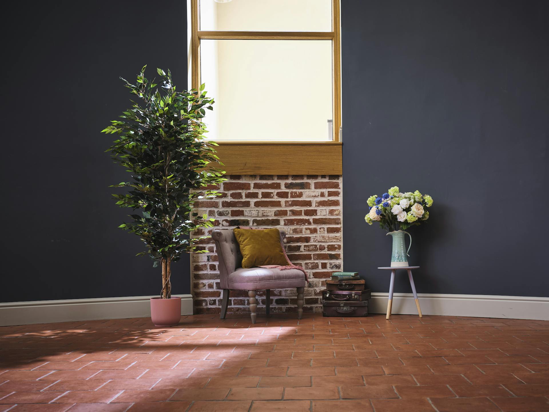 Faux green ficus tree in pink pot with cottage garden bouquet