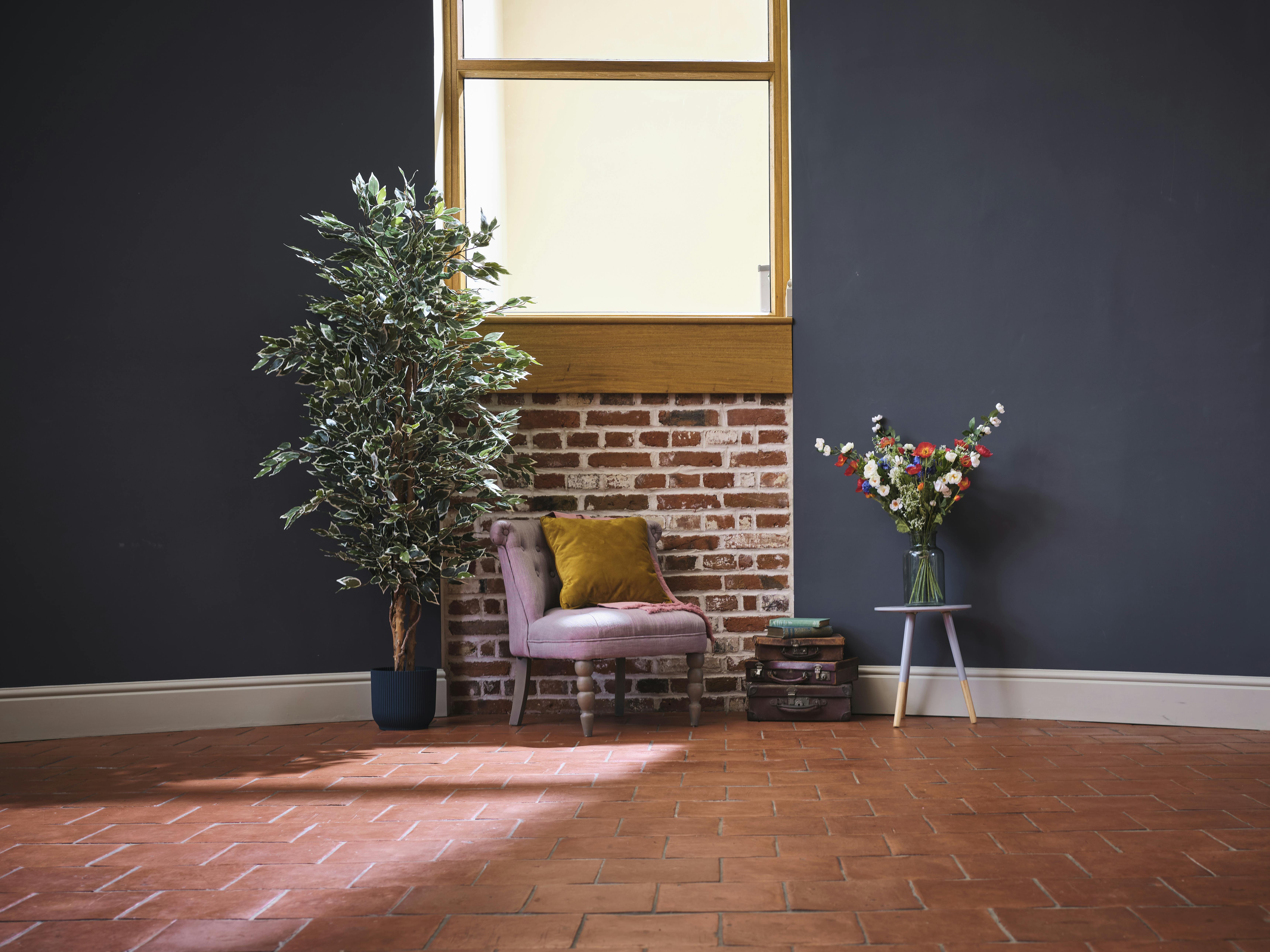 artificial variegated ficus tree next to armchair 180cm