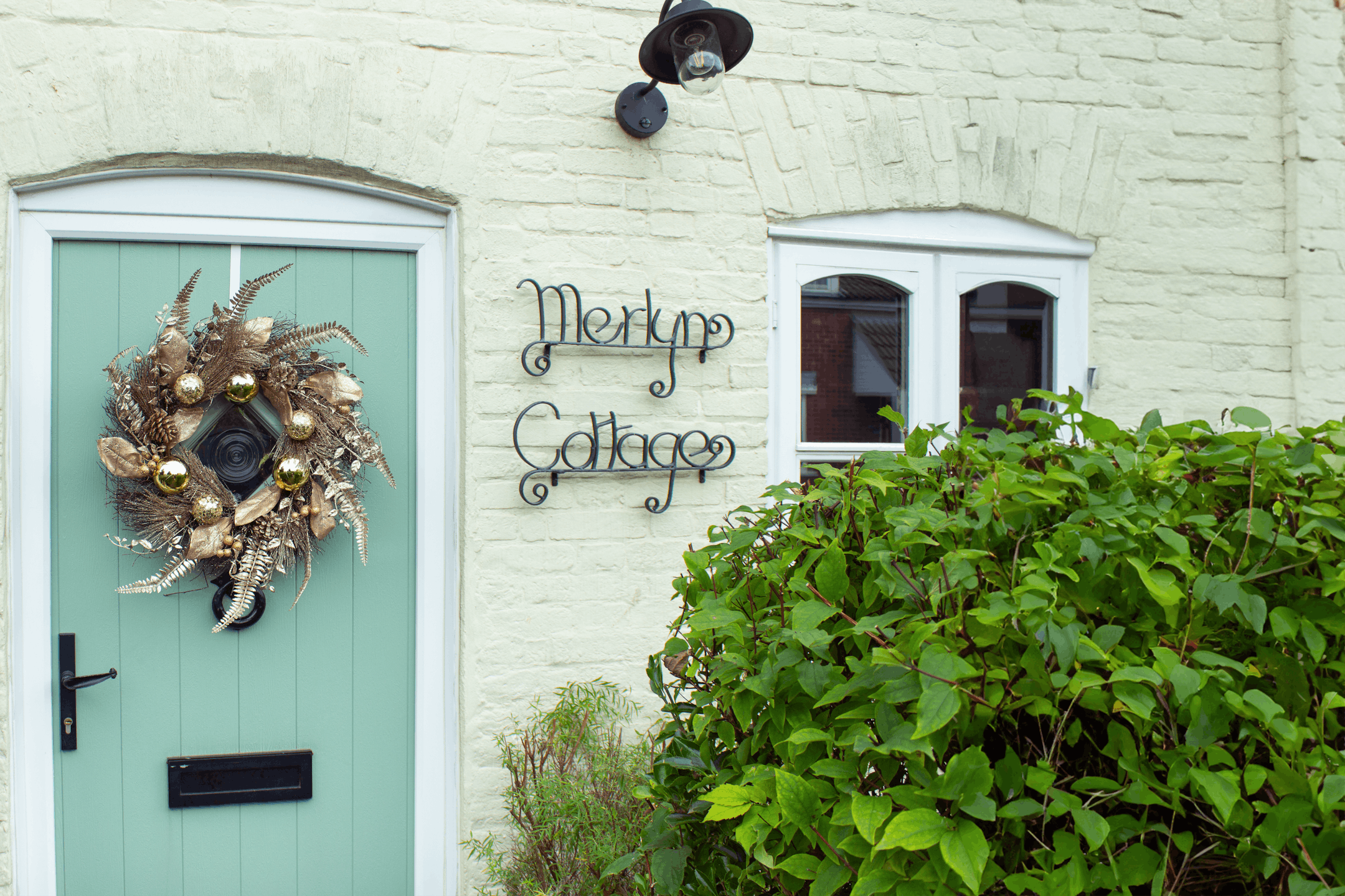 artificial-gilded-berry-wreath-on-front-door