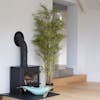 Large artificial Japanese style bamboo indoor plant by log burner