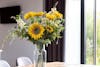 Summer artificial lazy days bouquet of flowers on table