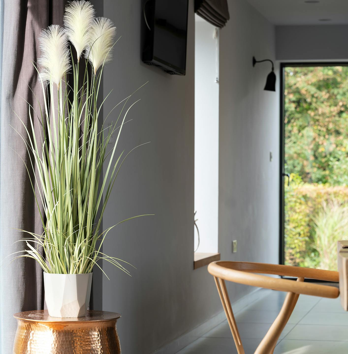 Artificial pampas grass on copper stand