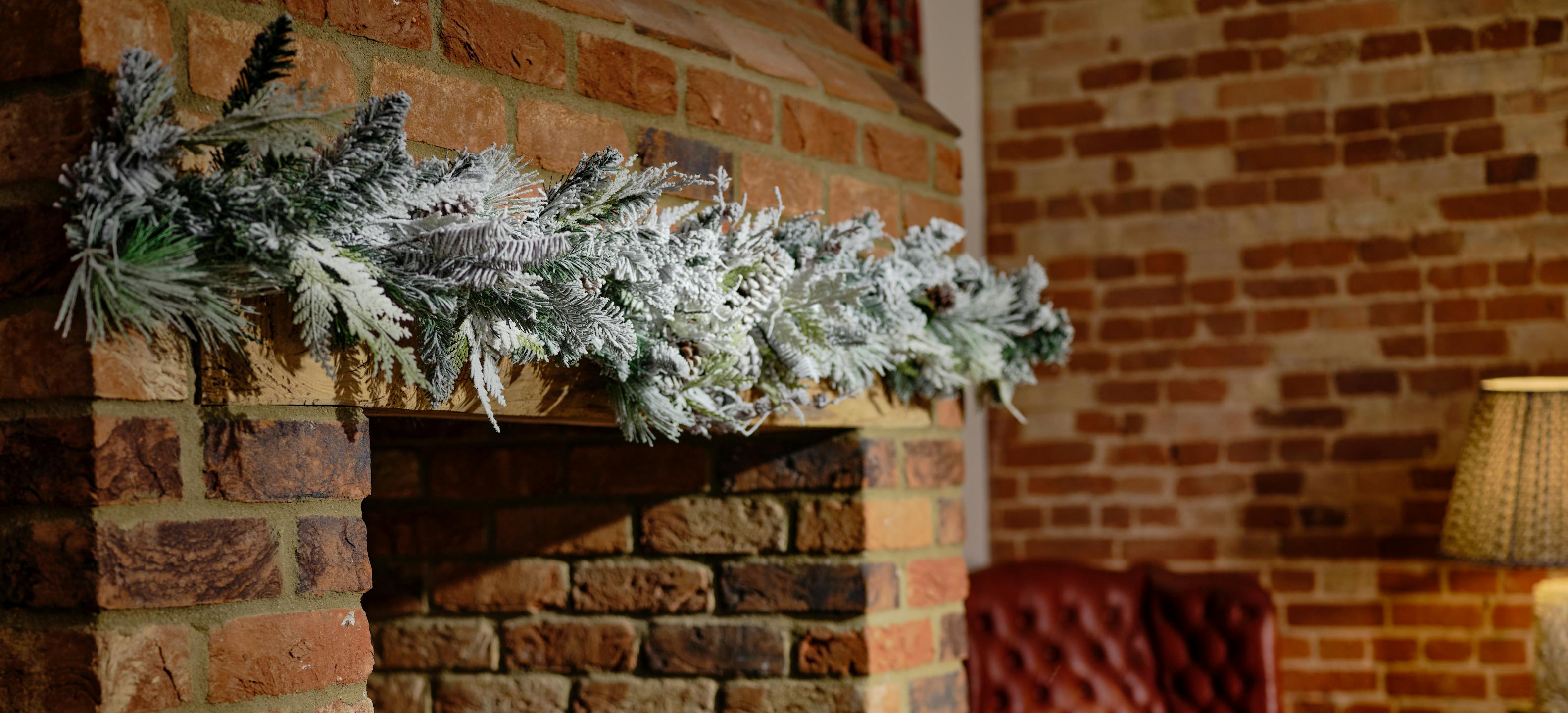 Wintery Siberian type Christmas garland over fireplace