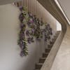 Artificial purple wisteria garland on staircase