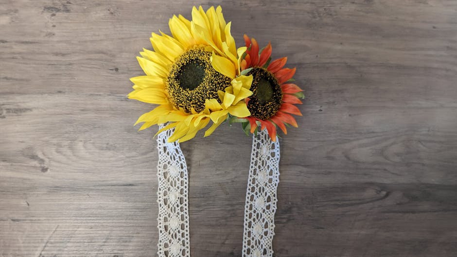 two sunflowers glued onto the piece of ribbon