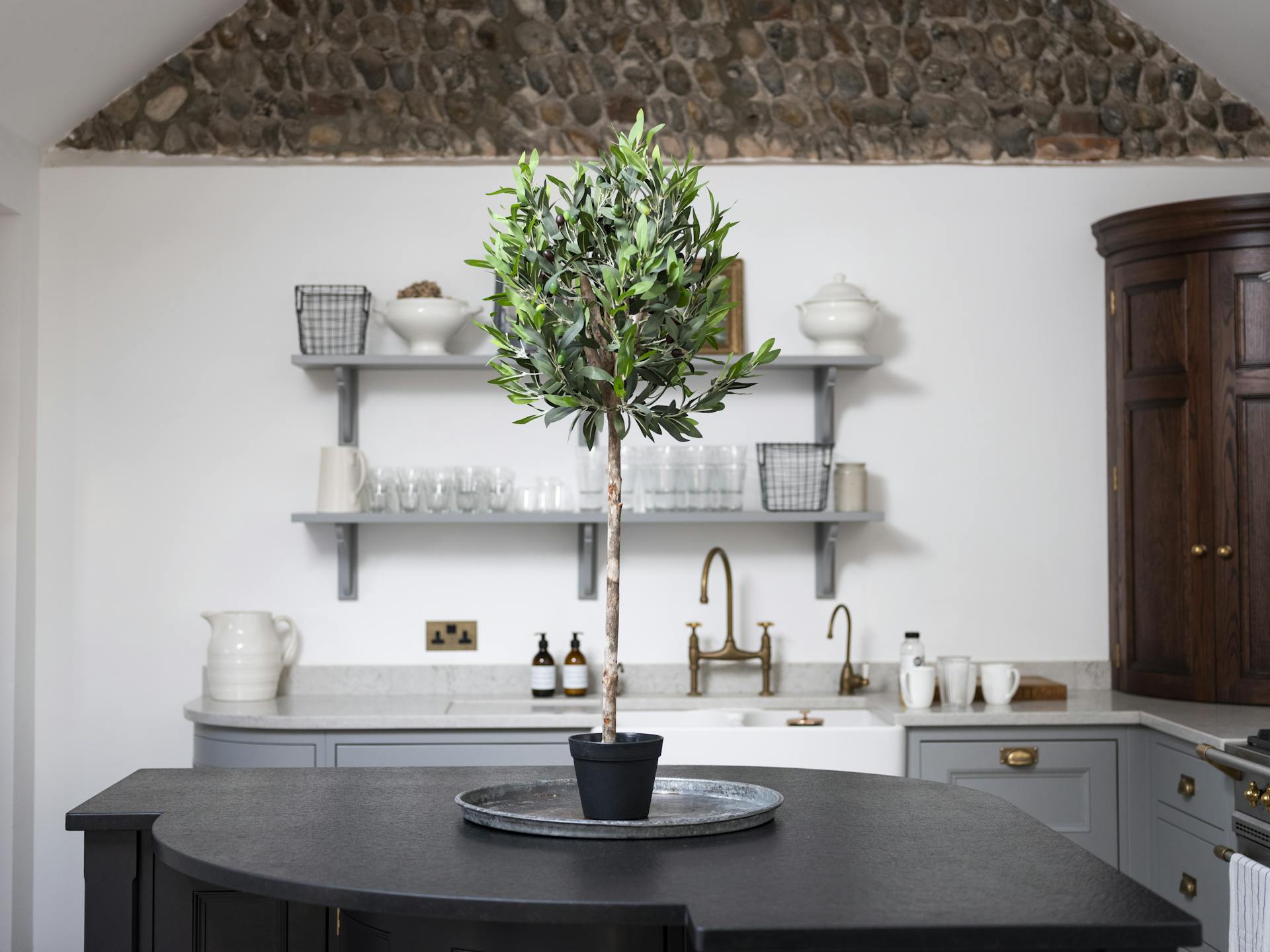 Artificial olive ball tree on kitchen island